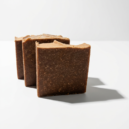 Grease Monkey Love soap on a white studio surface with an extended directional cast shadow